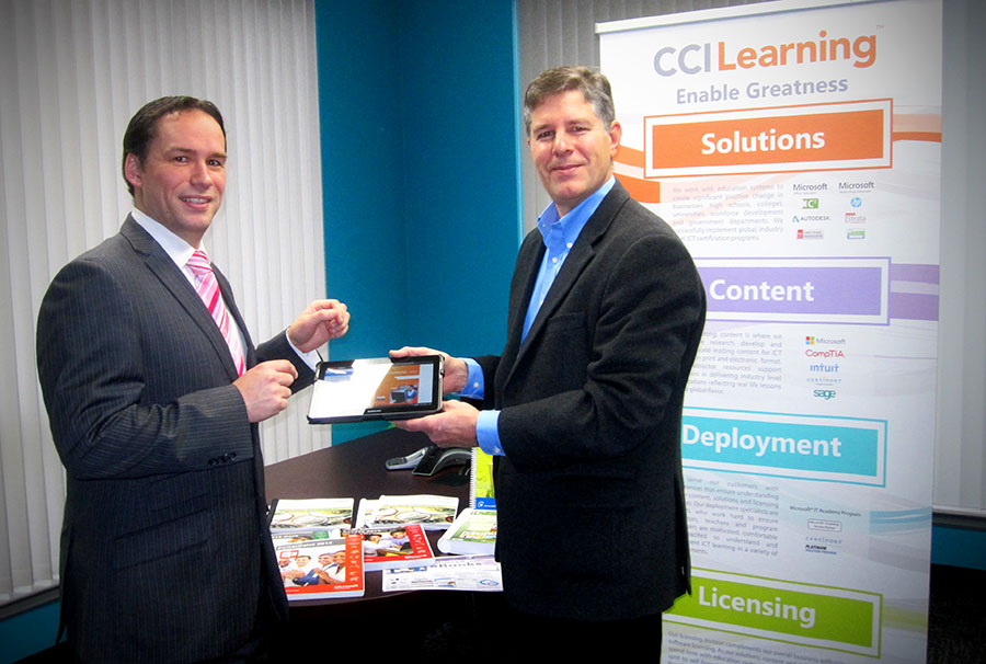MP Warawa with CCI Learning CEO Malcolm-Knox and courseware textbooks